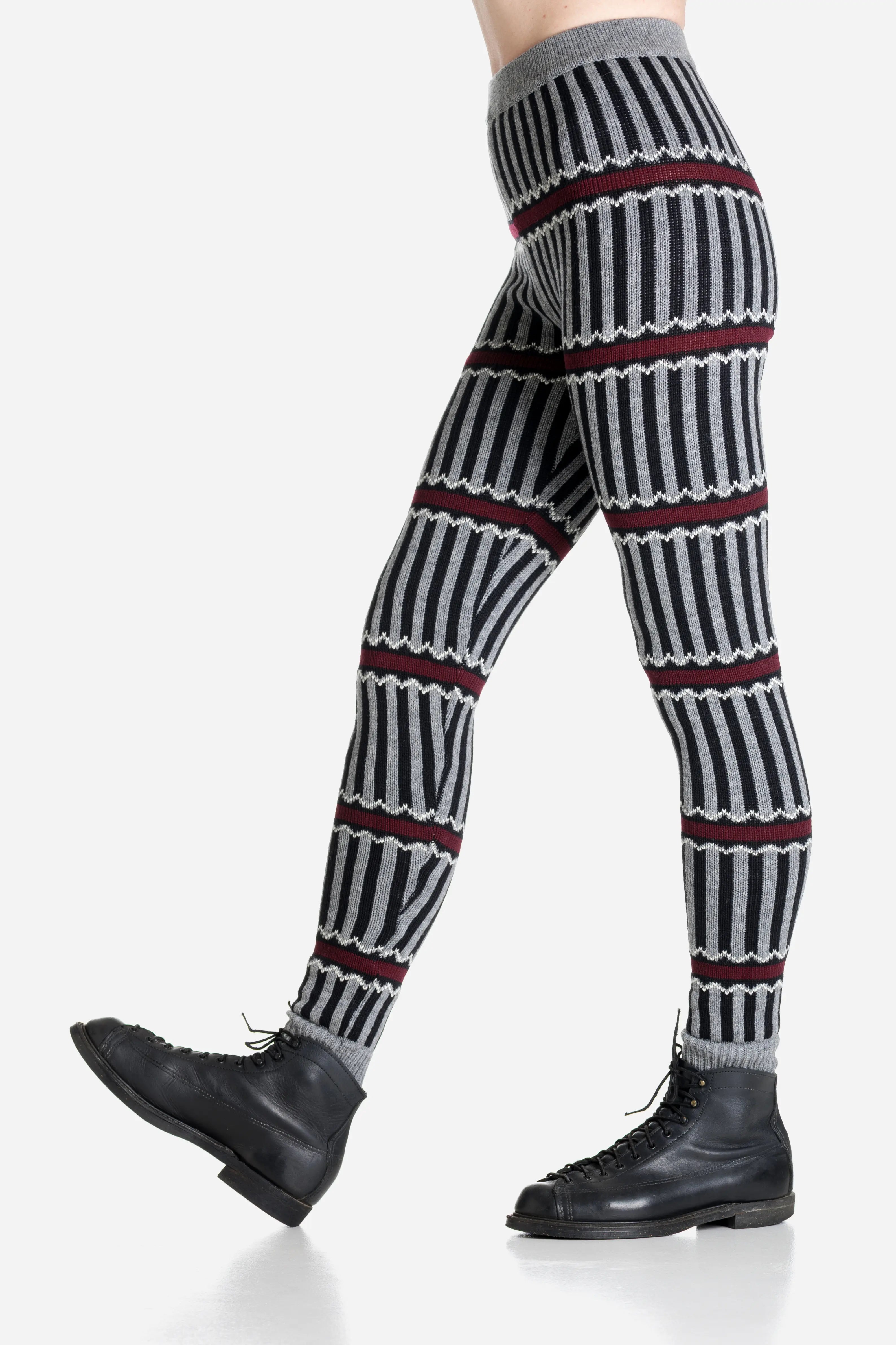 Striped patterned merino leggings worn by a person on a light gray background