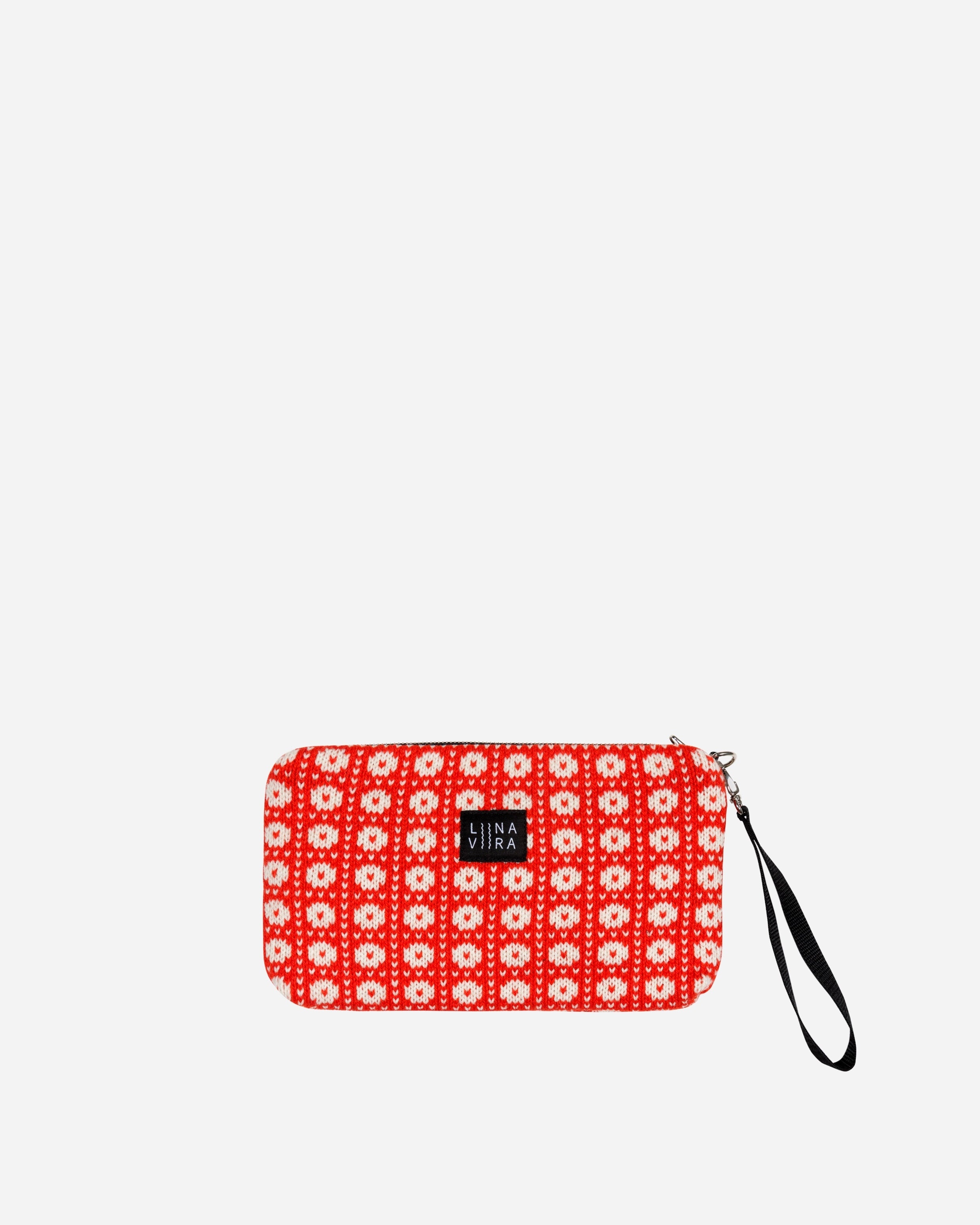 Red and white patterned pouch with a wrist strap on a light gray background