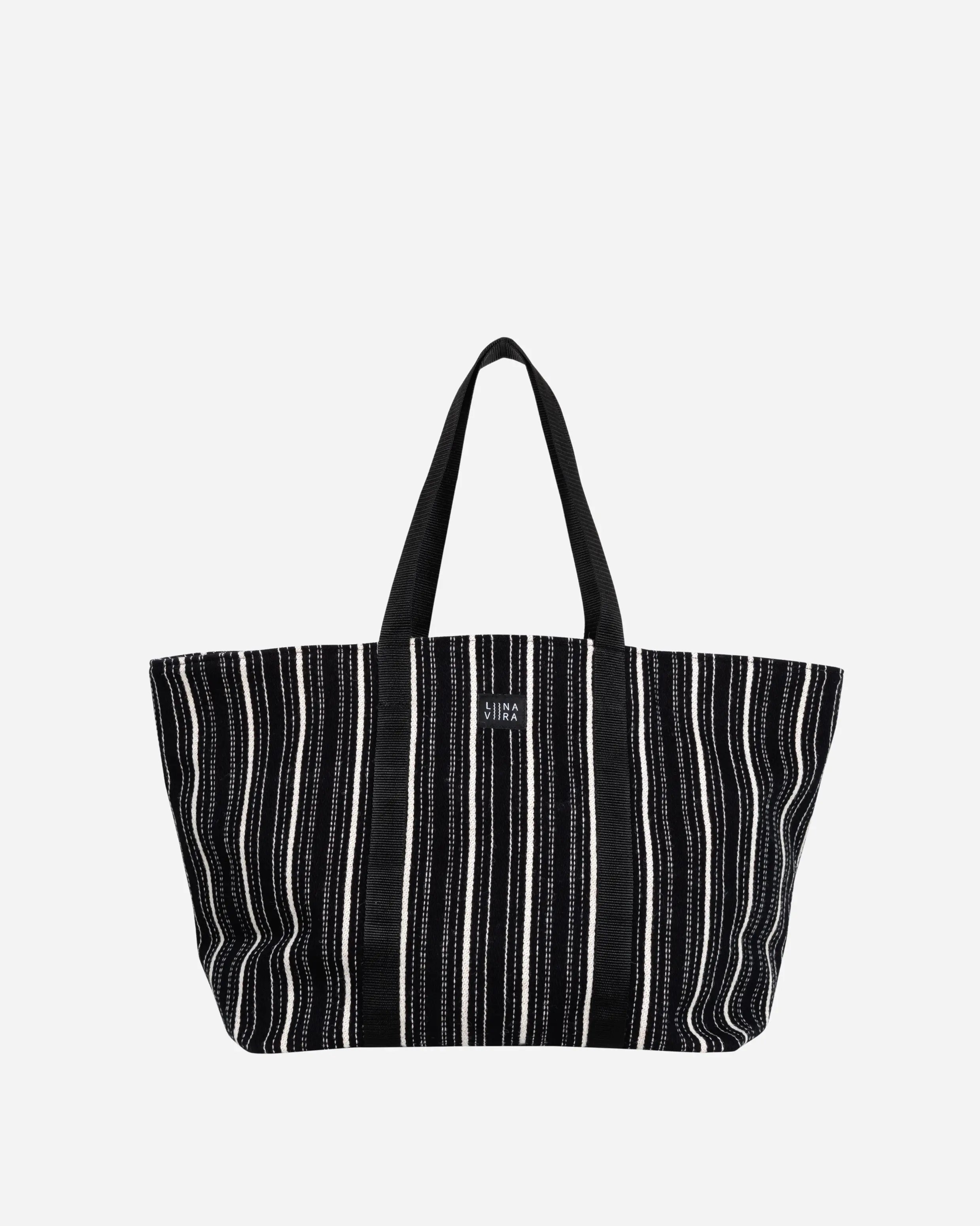 Black and white striped tote bag on a light gray background