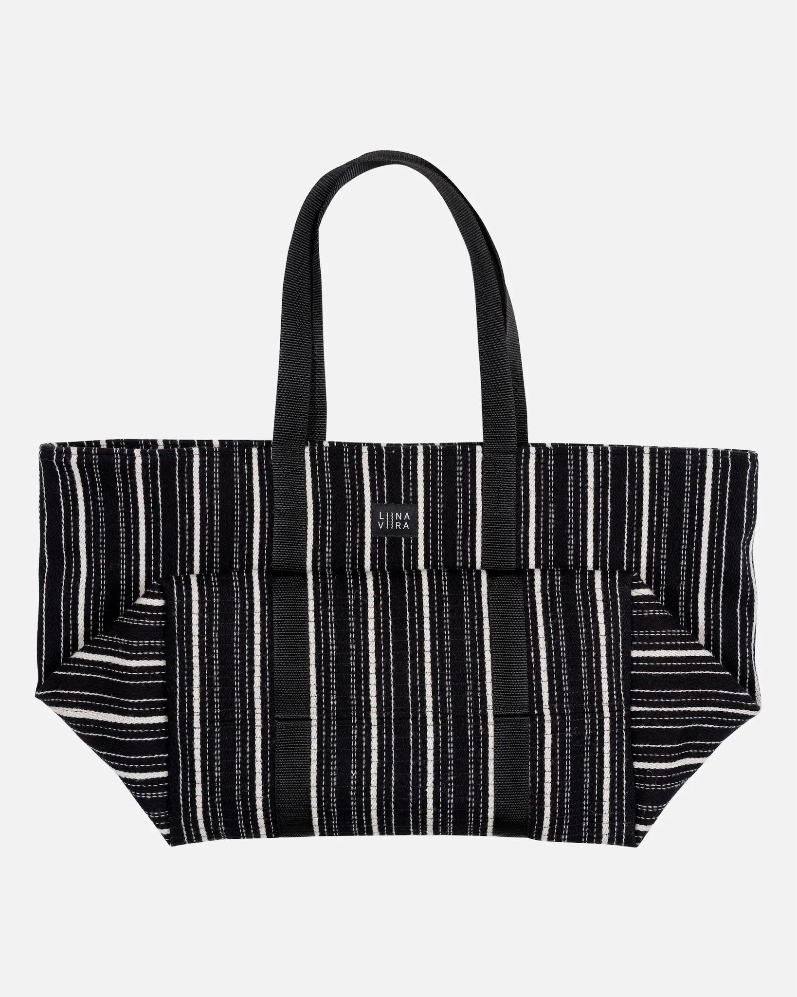 Black and white striped tote bag on a light gray background