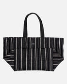 Black and white striped tote bag on a light gray background