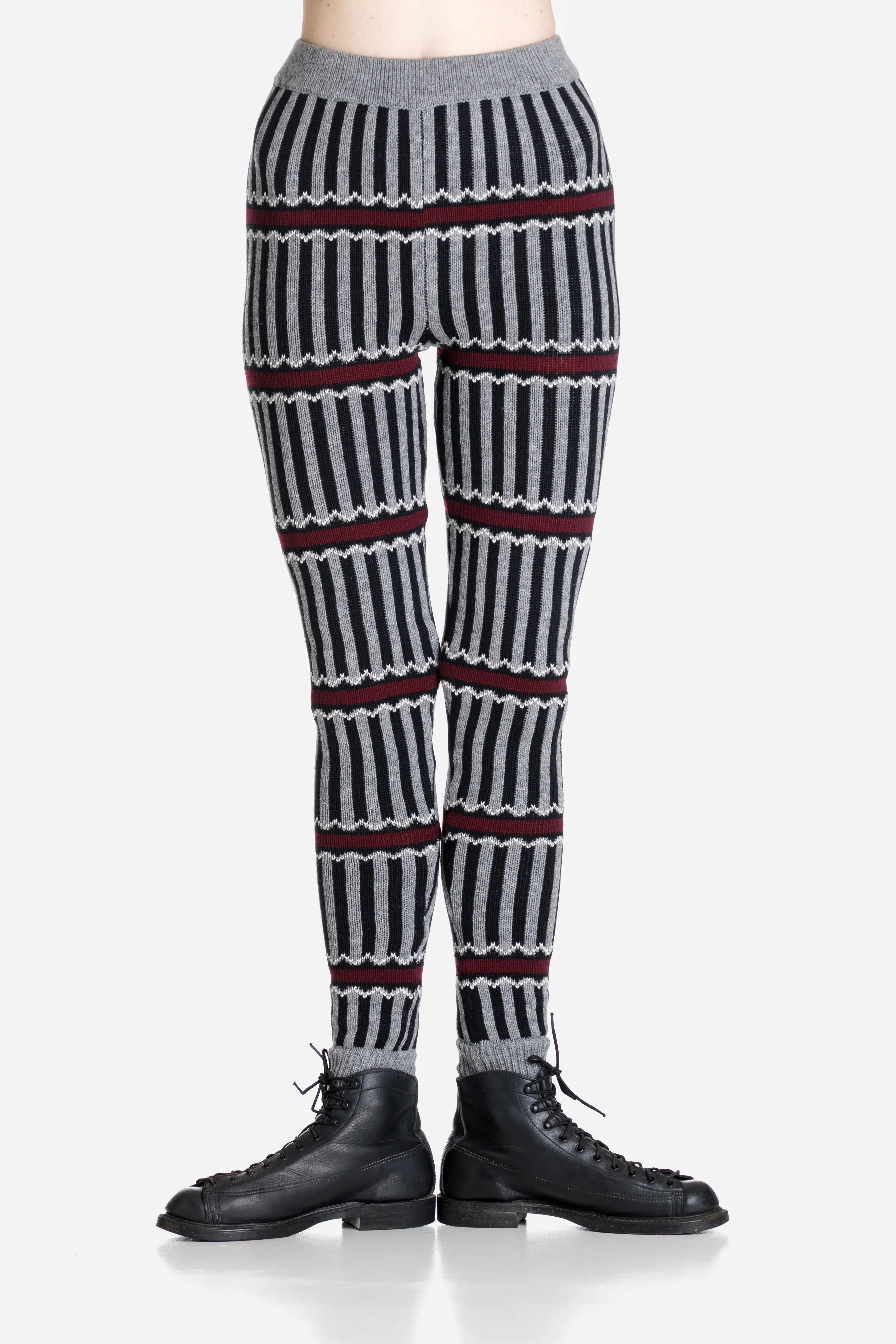 Striped patterned merino leggings worn by a person on a light gray background