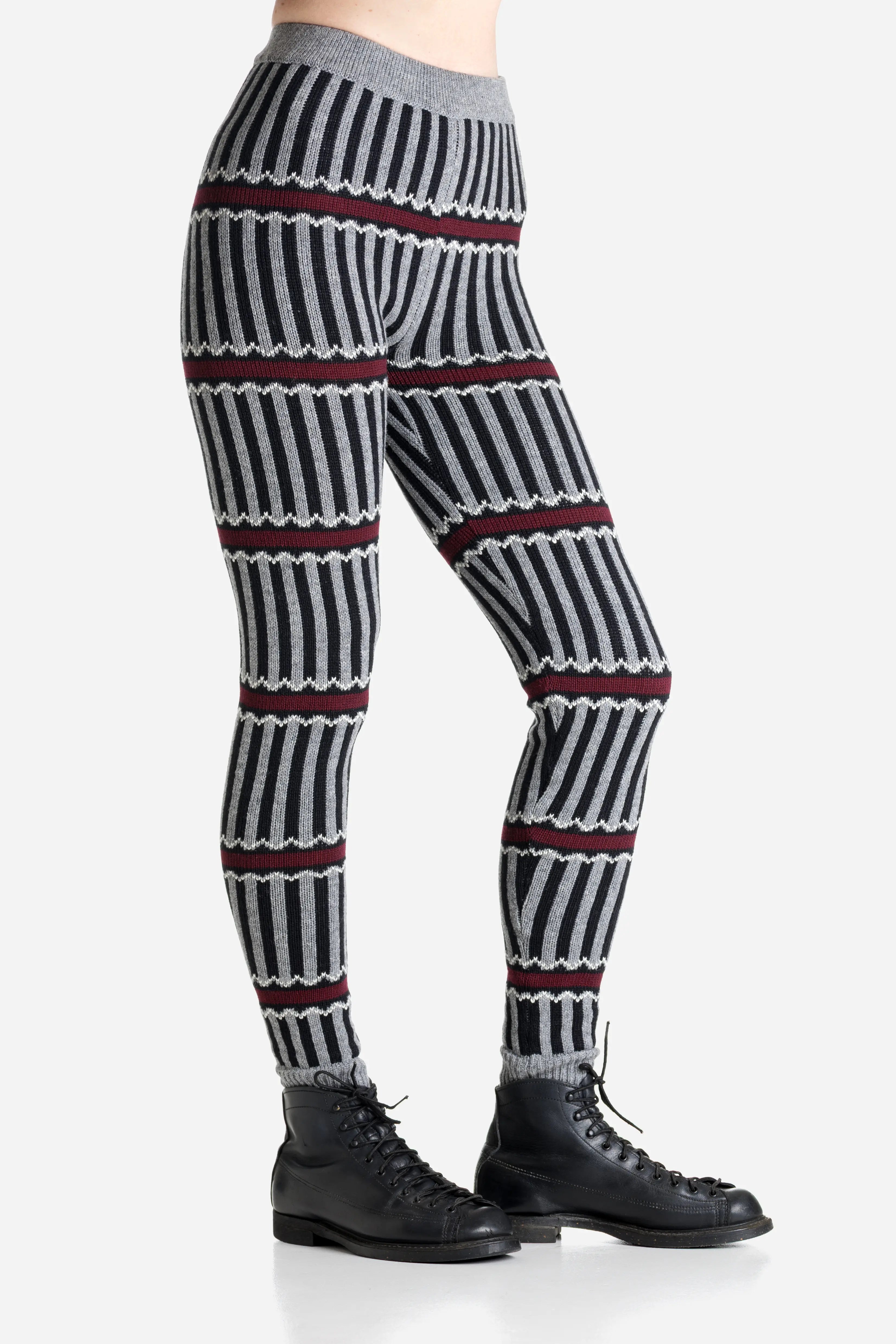 Striped patterned merino leggings worn by a person on a light gray background