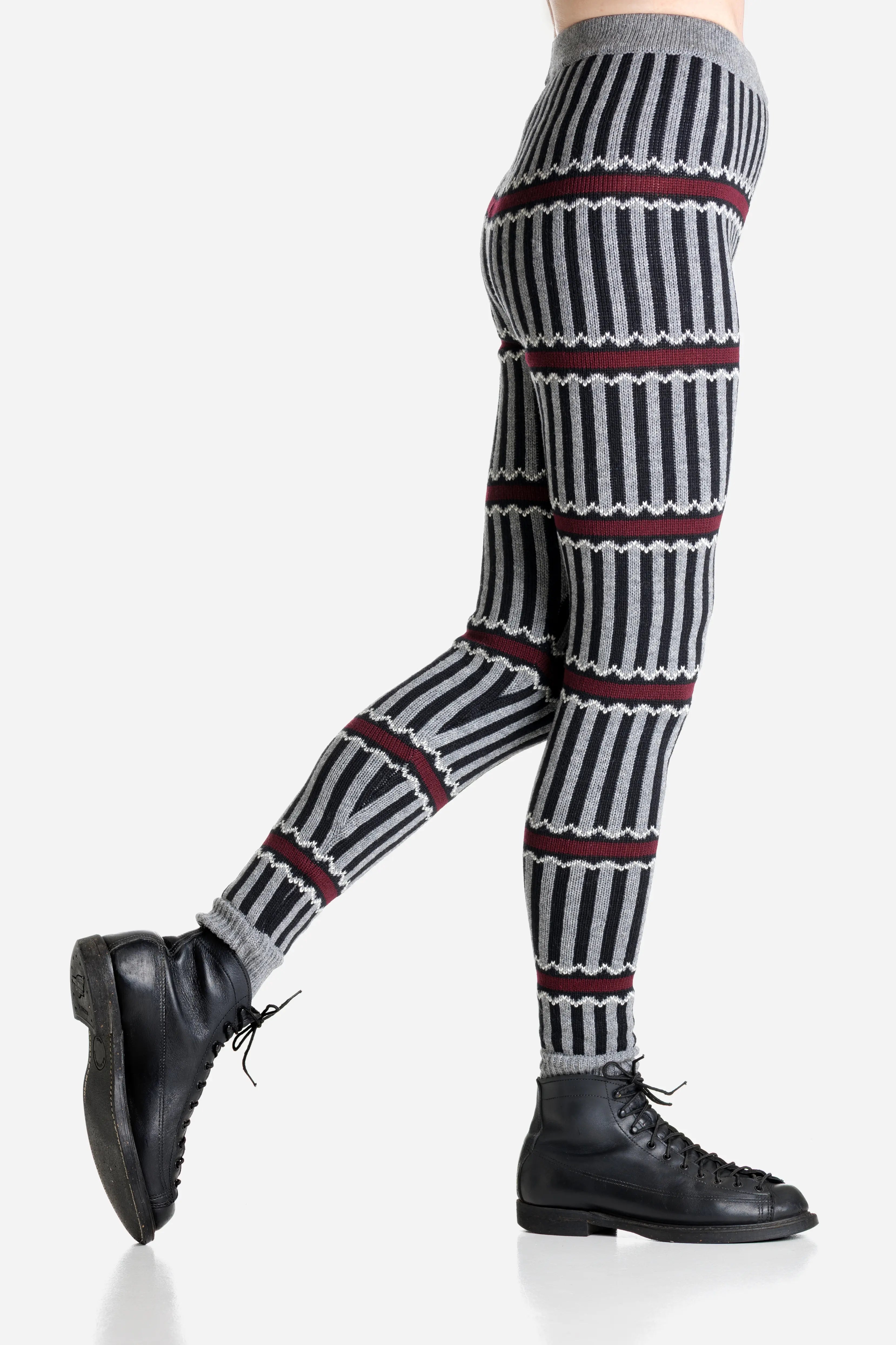 Striped patterned merino leggings worn by a person on a light gray background