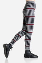 Striped patterned merino leggings worn by a person on a light gray background